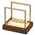 Péndulo de Newton Iluminado con Marco Dorado y Base de Madera